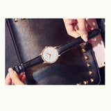 Carved Pattern Dial Leather Strap Women's Watch